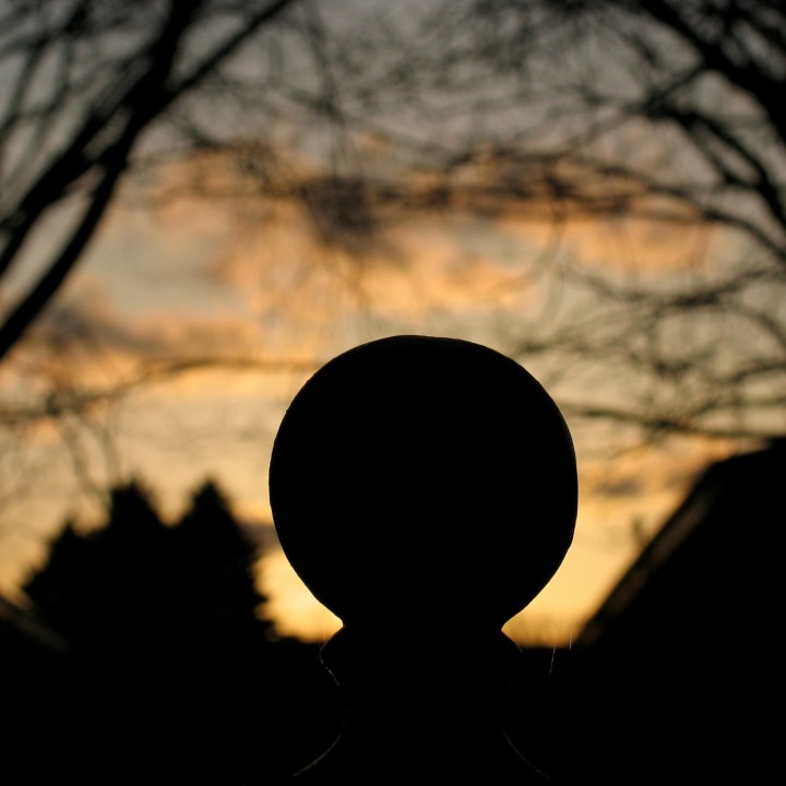 iron ball Fence post top at dusk