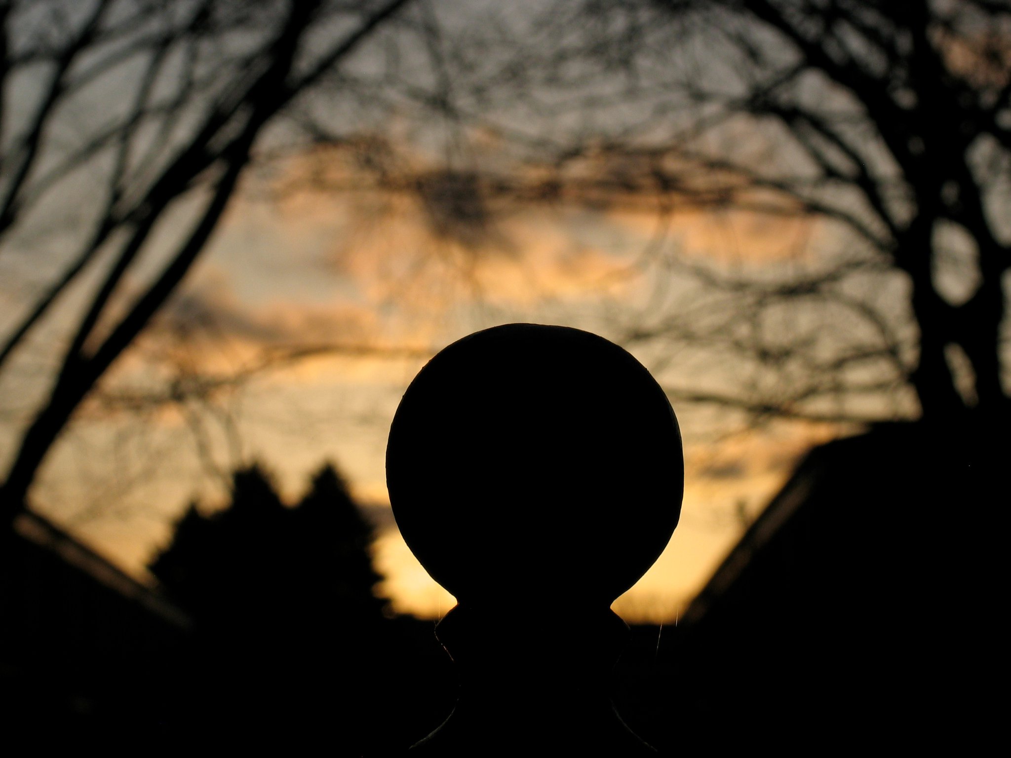iron ball Fence post top at dusk