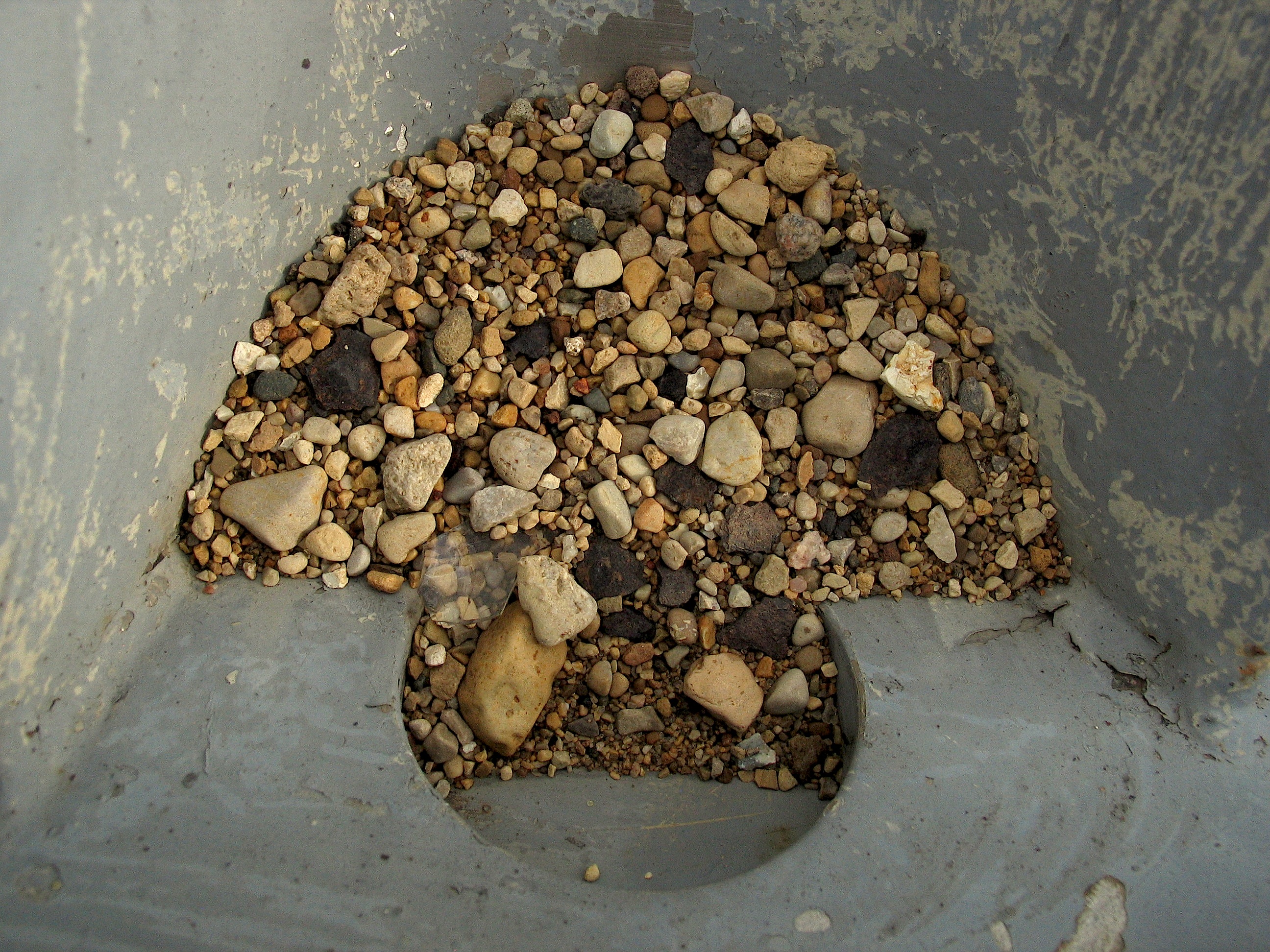A pile of stones on concrete
