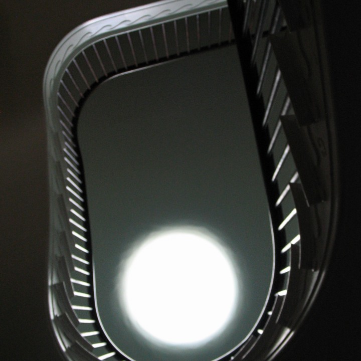 Looking up through a spiral staircase