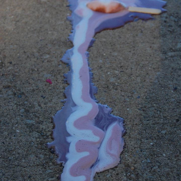 Ice cream melting on pavement