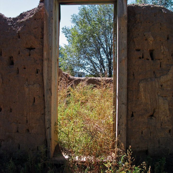 Unfinished adobe construction doorway new mexico